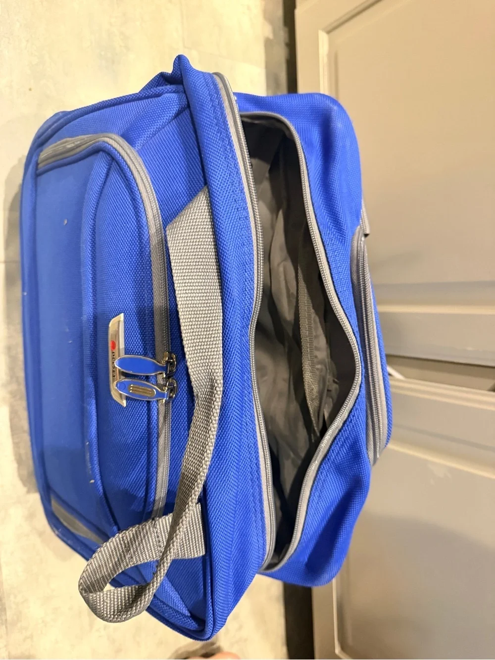 Delsey Underseat Carry On Rolling Tote Blue Softside Travel Bag